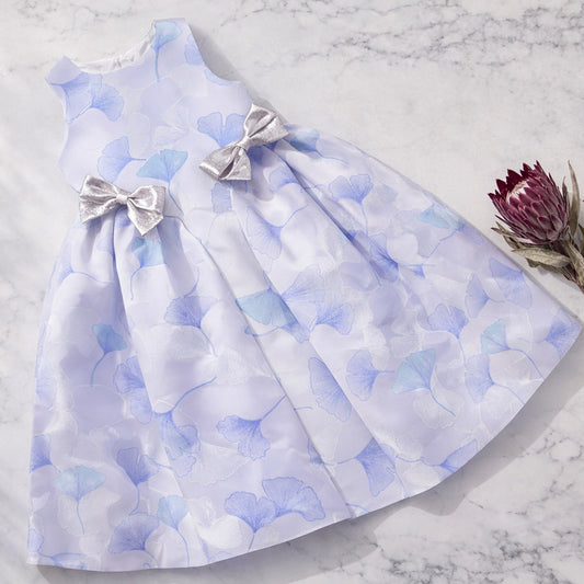 Light blue and white floral midi dress with gathered skirt and satin bow ties at waist