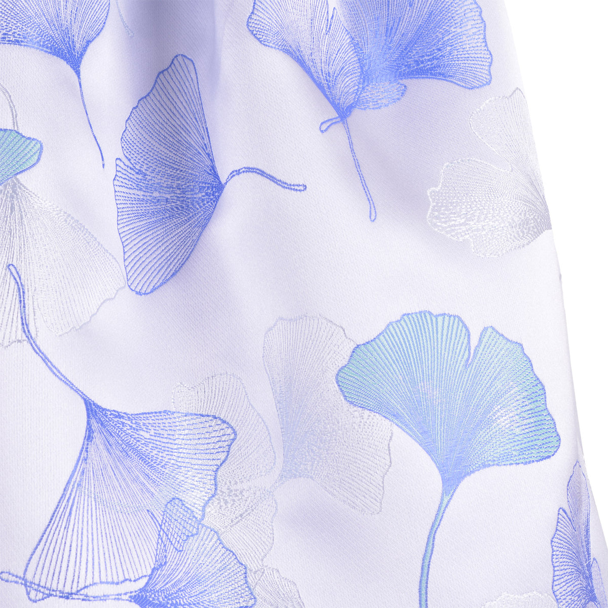 Light-colored fabric with large blue ginkgo leaf floral pattern on sleeveless dress