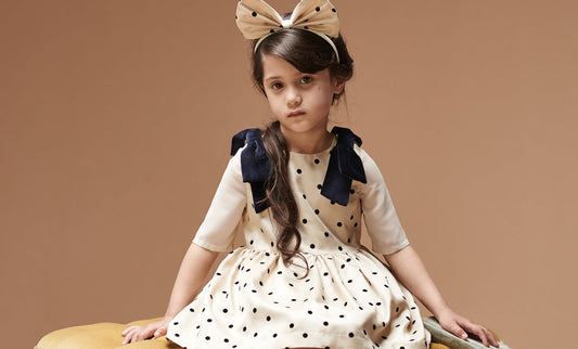 girl wearing spotty dress