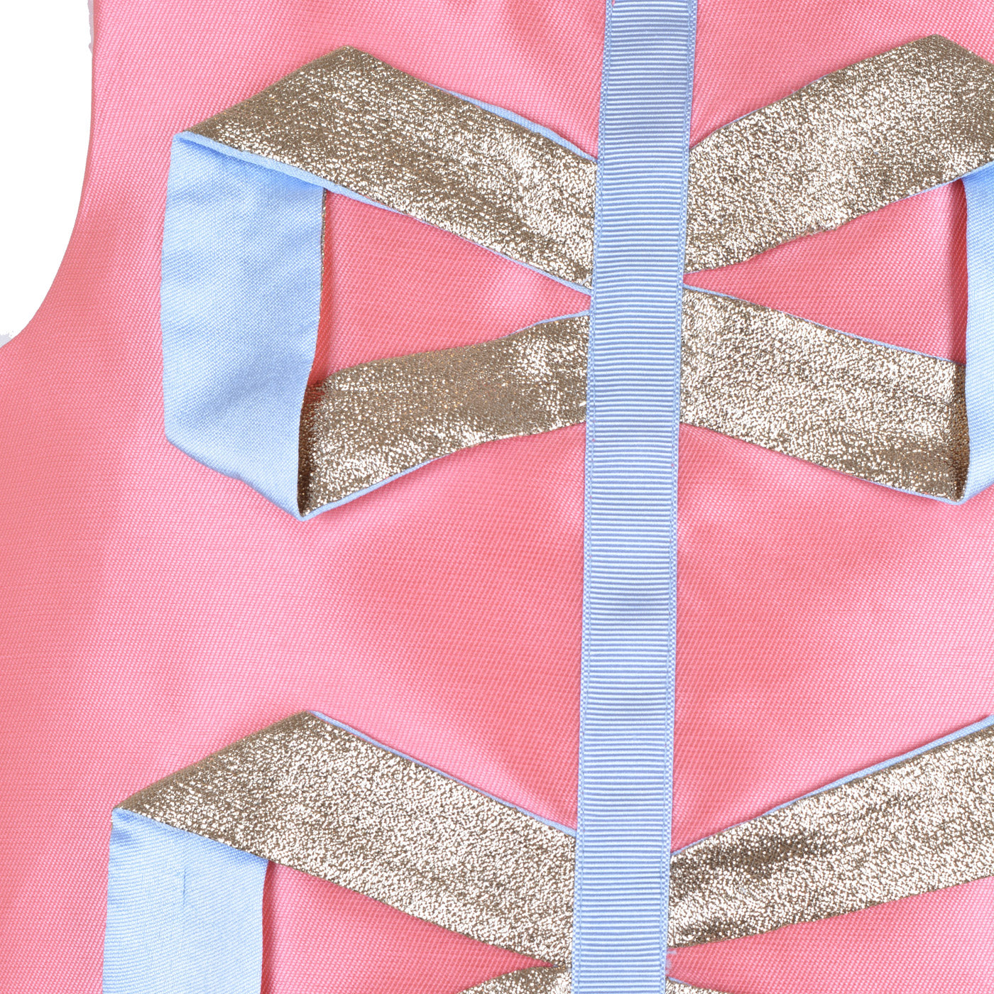 Origami ribbon trim detail: gold metallic and light-blue bands on pink fabric.
