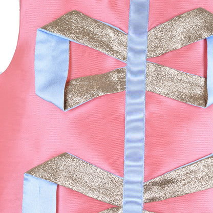 Origami ribbon trim detail: gold metallic and light-blue bands on pink fabric.