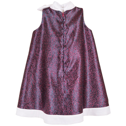 Back view trapeze dress in speckled glitter fabric, white hem trim, center-back buttons