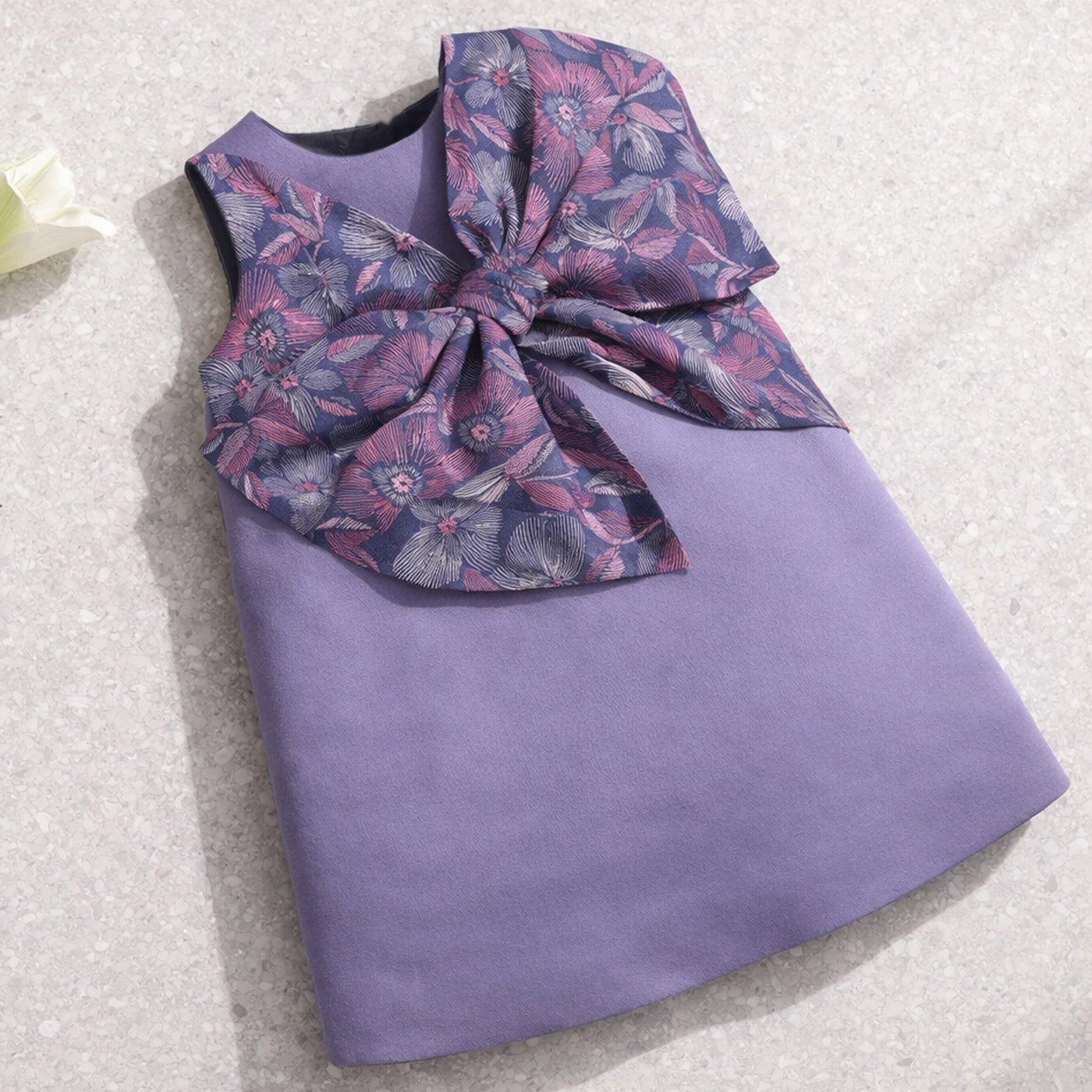 Lavender shift dress with oversized floral bow detail at waist