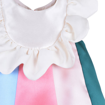 White ruffle bib dress with pink and blue color-block front panel