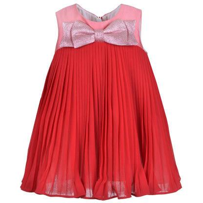 Sleeveless trapeze dress with pink bow at neckline and red pleated skirt