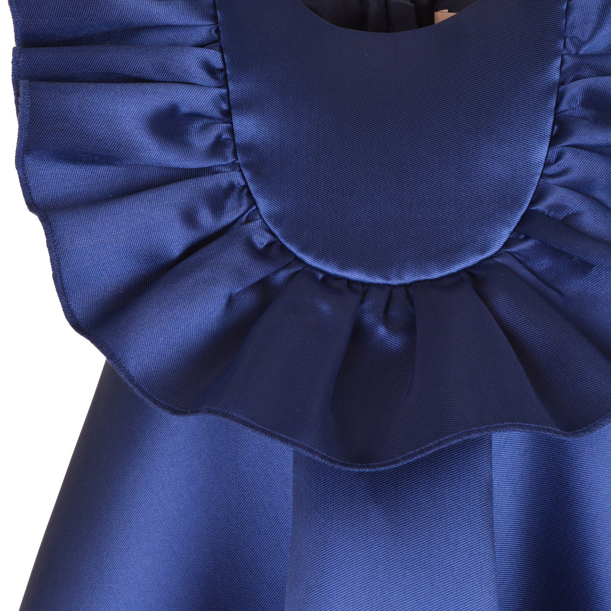 Blue ruffle bib and layered ruffles on satin trapeze dress
