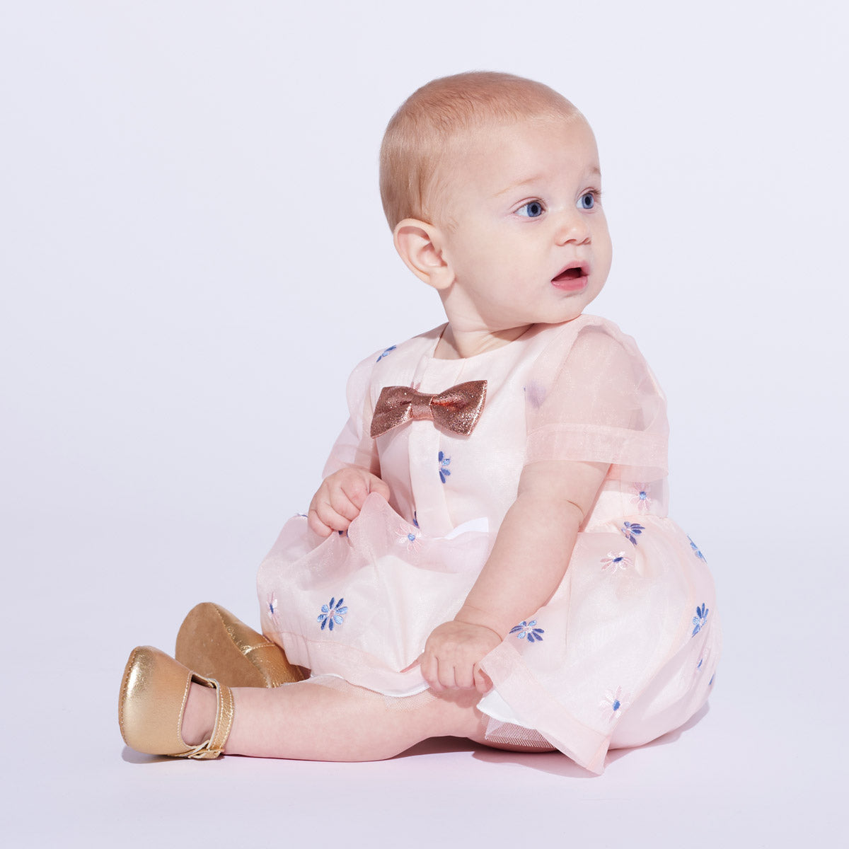 Baby mini bow bodice dress with blue floral print and sheer sleeves, paired with bloomers