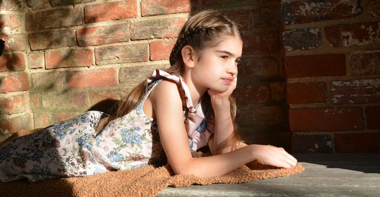 girl lying on a coat in the sun
